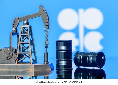 Petroleum, petrodollar and crude oil concept : Pump jack and flag of OPEC or Organization of Oil Exporting Countries, depicting the investment in the development or production of global oil industry. - Shutterstock ID 2174533191