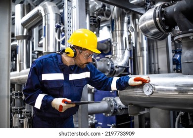 Petroleum Refinery Worker Standing By Pipes Stock Photo 2197733909 ...