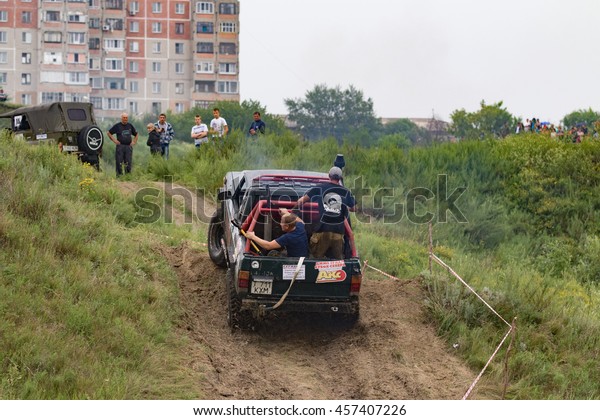 Petropavlovsk, Kazakhstan - JULY 24, 2016:
off-road vehicle cars moving on the off road at competitions,
Petropavlovsk, Kazakhstan. Joyful
viewers.