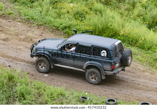 Petropavlovsk, Kazakhstan - JULY 24, 2016:
off-road vehicle cars moving on the off road at competitions,
Petropavlovsk, Kazakhstan. Joyful
viewers.