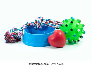 Pets are friends concept.  Pet bowl and rubber toys with rope for dog or cat isolated on white background.
