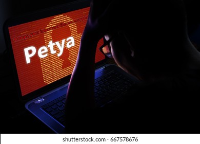 Petya ransomware attack on notebook screen,cyber attack internet security concept