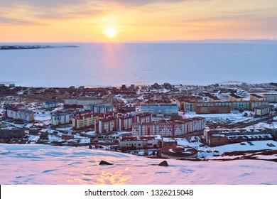 Pevek Is The Northernmost City In Russia. In May, During A Polar Day In The Arctic, The Sun Does Not Disappear Over The Horizon At Night. The Arctic Ocean Is Covered In Ice. Chukotka, Russian Far East