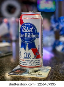 Pewaukee, Wisconsin/USA-November 27, 2018:  12 Ounce Can Of Pabst Blue Ribbon Beer On A Bar Counter With A Coaster.