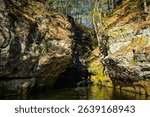 Pewits Nest in Wisconsin showcasing scenic glacier-carved gorge, cascading waterfall, and forest stream.