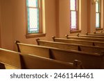 Pews and Stained Glass Windows in Church