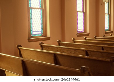 Pews and Stained Glass Windows in Church - Powered by Shutterstock