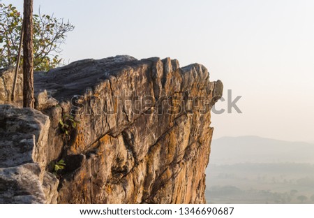 Pha Hua Rue Rock Cliff Phayao Attractions Thailand with Warm Sun Light and Tree Zoom Scene. Natural stone or rock mountain at Phayao northern Thailand travel
