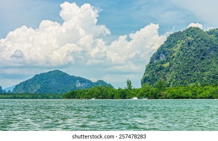 Phang Nga bay and mountain view with dramatic cloud and blue sky in Phang Nga national park of Thailand - Shutterstock ID 257478283