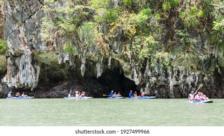 Phang Nga Bay, Thailand - 02.24.2016: Tourists Kayaking Near Limestone Caves In Phang Nga Bay