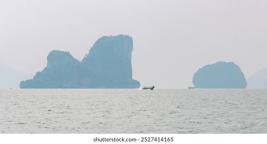 Phang Nga, Thailand - October 26, 2016: Traditional boat sails by limestone karsts. - Powered by Shutterstock