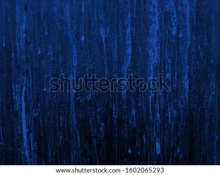 Phantom blue color & neon splatter on leak vintage background. Paint splatter & leak on phantom blue metal background. Splash of color paint on phantom blue wall splatter. Turquoise neon color leak