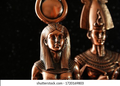 Pharaoh Tutankhamun with the goddess ISIS on a black background. Egyptian history.