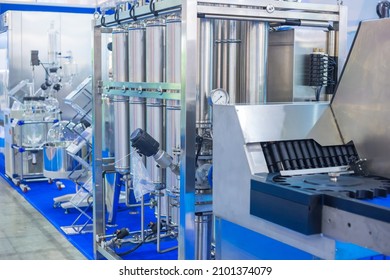 Pharmaceutical Automatic Production Equipment At Modern Pharmacy Factory Or Exhibition. Manufacturing, Pharma Industry, Medicine And Automated Technology Concept