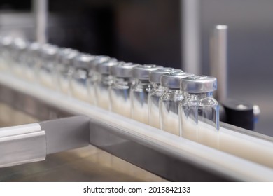 Pharmaceutical Automatic Production Line - Conveyor Belt With Empty Medical Injection Glass Vials At Pharmacy Factory. Manufacturing, Pharma Industry, Medicine, Automated Technology Equipment Concept