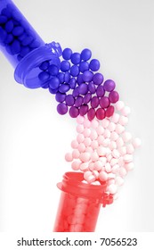 Pharmaceutical Concept Showing Drug Interaction Between Red And Blue Pill Bottles