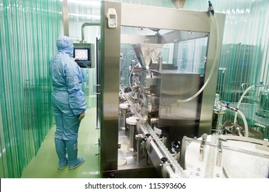 pharmaceutical factory woman worker operating production line at pharmacy industry manufacture factory