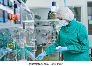 Pharmaceutical Factory Woman Worker Operating Production Line At Pharmacy Industry Manufacture Factory