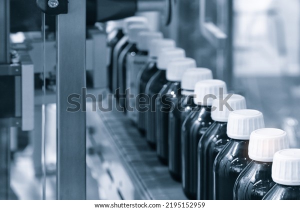 pharmaceutical industry, medicine pills are\
filling in the  bottle on production line machine conveyor at the\
medical factory. selective\
focus.
