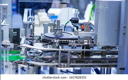 pharmaceutical industry. Production line machine conveyor at factory with bottles.