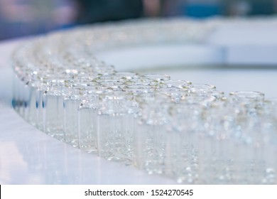 Pharmaceutical Industry, Science, Manufacturing, Medicine And Automated Pharma Technology Equipment Concept - Conveyor Belt With Empty Glass Bottles - Pharmaceutical Automatic Production Line