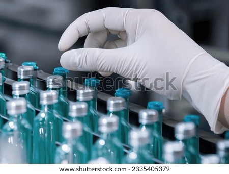 Pharmaceutical Manufacturing Process: Pharmaceutical Machine Working on Production Line of Medical Vials