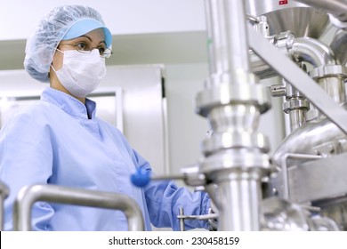 Pharmaceutical Manufacturing Technologist. Preparing Machine for Work in Pharmaceutical Factory. Chemical Industry. Pharmaceutical Factory Worker. Pharmaceutical Industry. Technology background.