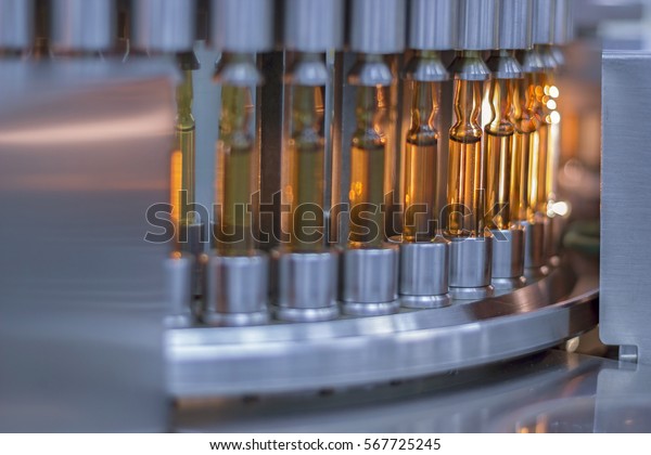 Pharmaceutical Optical Ampule / Vial\
Inspection Machine. Inspects Vials and Ampules for Particulates in\
Liquid and Container Defects. Pharmaceutical Manufacturing. Vaccine\
Manufacturing.