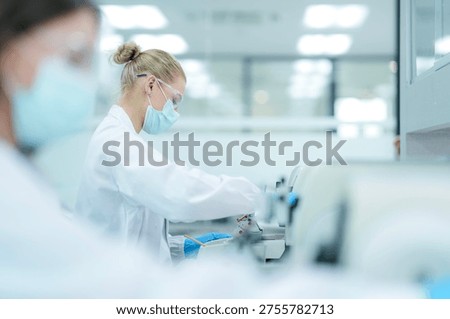 Pharmaceutical quality control analyst validating equipment sterility protocols. RD chemist monitoring autoclave sterilization cycle for biopharmaceutical compliance.