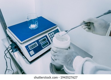 Pharmaceutical Worker Measures The Raw Material For The Drug