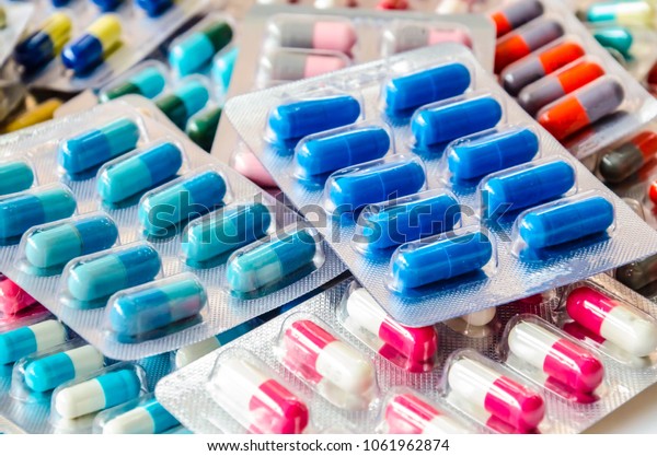 pharmaceuticals\
antibiotics pills medicine /colorful antibacterials pills on  white\
background /capsule pill medicine\

