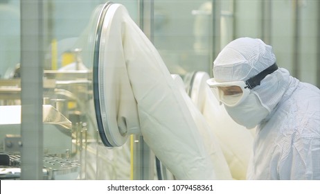 Pharmaceutics. Pharmaceutical worker operates blister packaging machine. Quality control. Pharmaceutics. Worker operator portrait