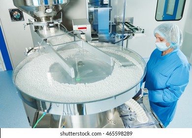 Pharmaceutics. Pharmaceutical worker operates tablet blister packaging machine