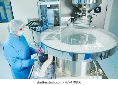 Pharmaceutics. Pharmaceutical worker operates tablet blister packaging machine
