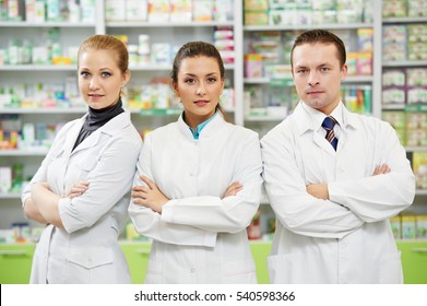 Pharmaceutist Woman And Man Workers In Drug Store