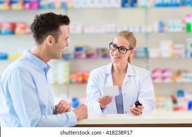 Pharmacist And Client At Pharmacy
