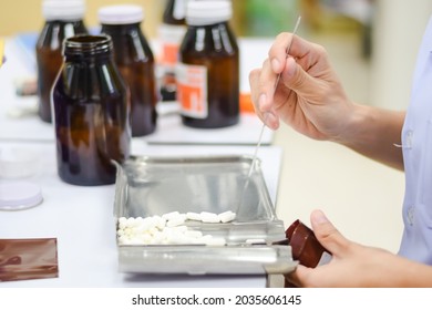 Pharmacist Counting Pills At The Pharmacy