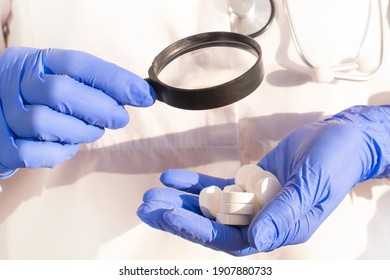 Pharmacist or expert on pharmaceutical inspection identifies pills. Testing, verification and determining pharmaceutical counterfeiting or fakes of medicines