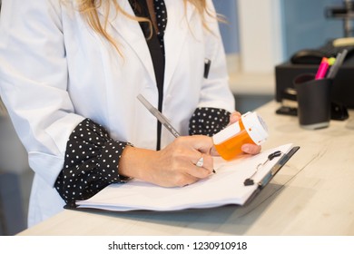 Pharmacist Filling Prescription In Pharmacy