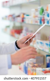 Pharmacist Filling Prescription In Pharmacy