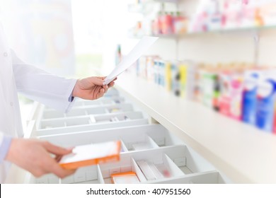 Pharmacist Filling Prescription In Pharmacy