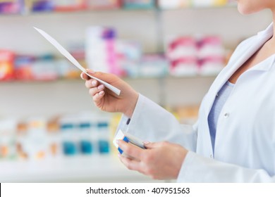 Pharmacist Filling Prescription In Pharmacy