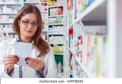 Pharmacist Filling Prescription In Pharmacy