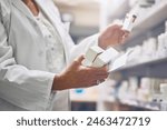 Pharmacist, hands and box for drugs with document at shelf for medicine, check and inventory for health. Person, employee and container for prescription, search and pharma paperwork for pills at shop