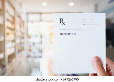 Pharmacist hold blank prescription in pharmacy store