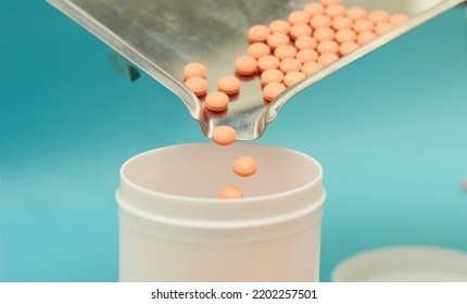 pharmacist pour pills into bottle  - Powered by Shutterstock