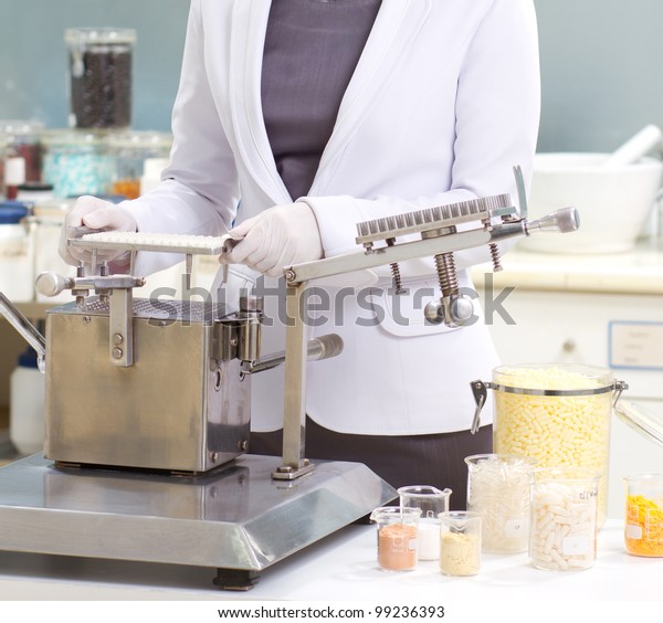 Pharmacist Preparing Medication Packaging Capsule Machine Stock Photo