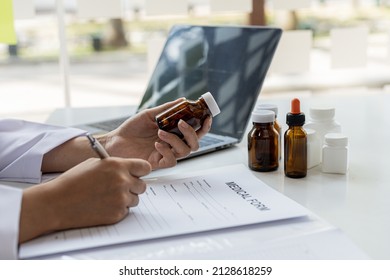 The Pharmacist Is Reviewing The List Of Drugs And Checking The Stock Of All Medicines At One Of The Pharmacies He Owns, His Home Pharmacy And Selling Medical Supplies. Pharmacy Concept.