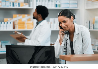 Pharmacist, woman and phone call for customer support, medicine stock and inventory communication or retail service. Medical worker or doctor on telephone and computer for pharmacy or healthcare FAQ - Powered by Shutterstock