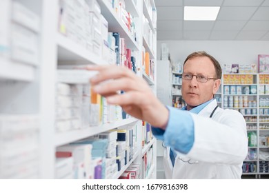 Pharmacist Working In A Drugstore